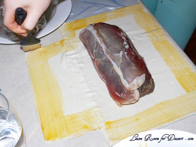 Brush the edges with egg yolk mix