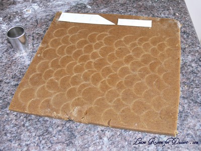 For the tiles on the roof - Use a small circle cutter to make semi circle indents in the dough before backing
